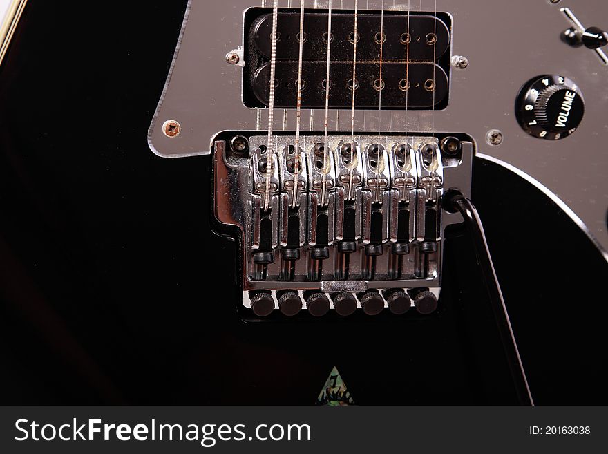 Detail from an electric guitar with tremolo, strings pickup