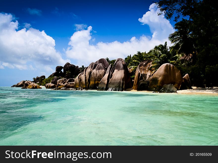 Detail of a granite stone on a beach of La Digue Island at the Seychelles island. The beach is in the famous Anse source dargent park. Detail of a granite stone on a beach of La Digue Island at the Seychelles island. The beach is in the famous Anse source dargent park.