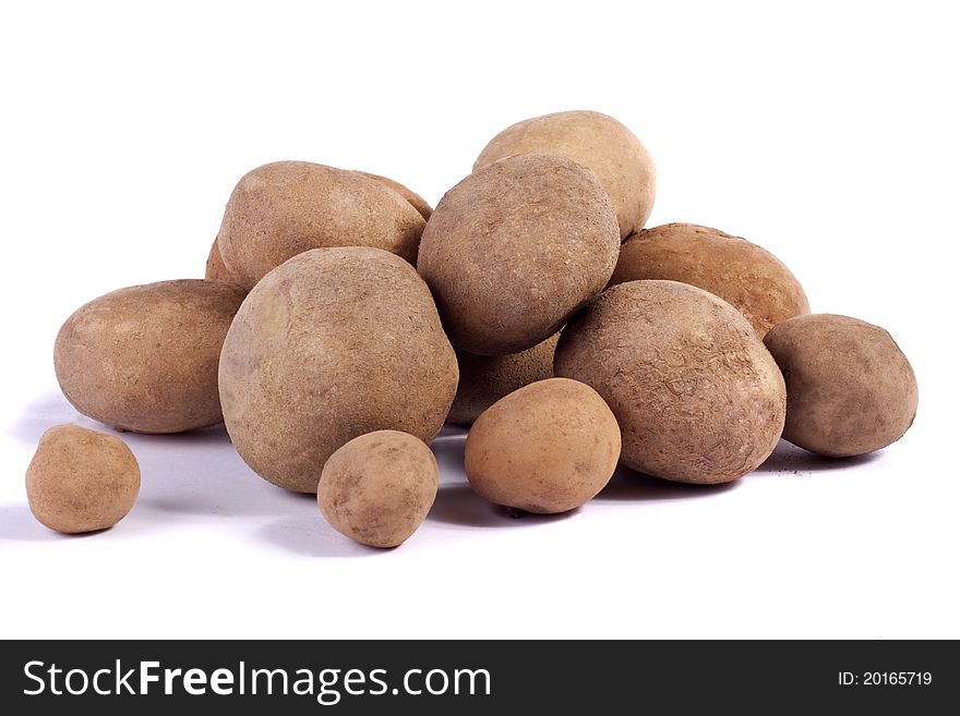 Close up view of some potatoes isolated on a white background. Close up view of some potatoes isolated on a white background.