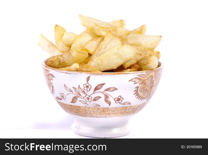 Close up view of a bunch of fried potatoes in slices.