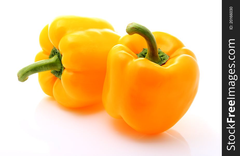 Image of two sweet yellow peppers isolated over white. Image of two sweet yellow peppers isolated over white