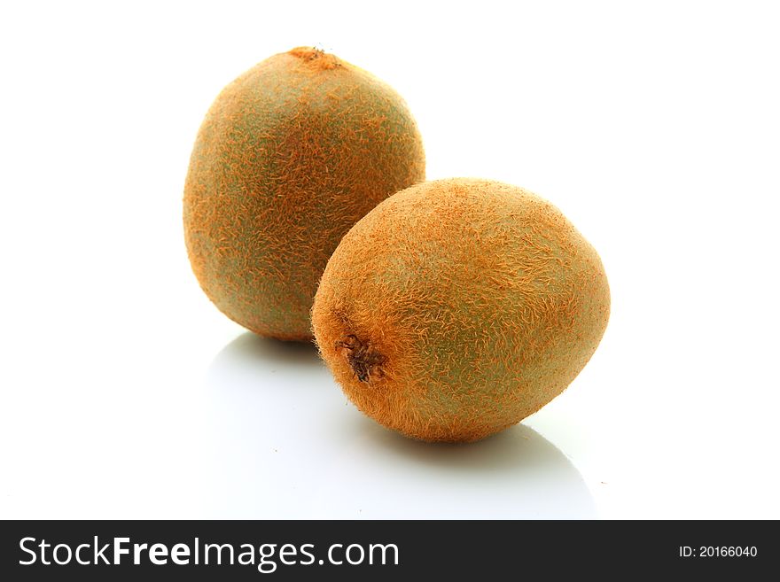 Image of whole kiwi fruits over white