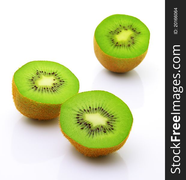 Image of sliced kiwi with reflection isolated over white. Image of sliced kiwi with reflection isolated over white