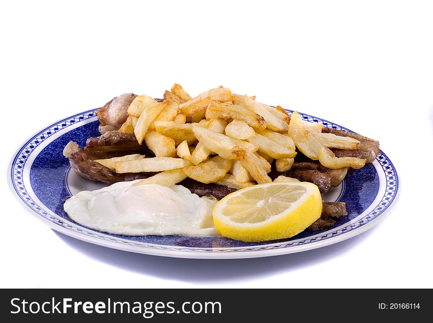 Close up view of a bunch of fried potatoes in slices, with egg and roasted meat. Close up view of a bunch of fried potatoes in slices, with egg and roasted meat.