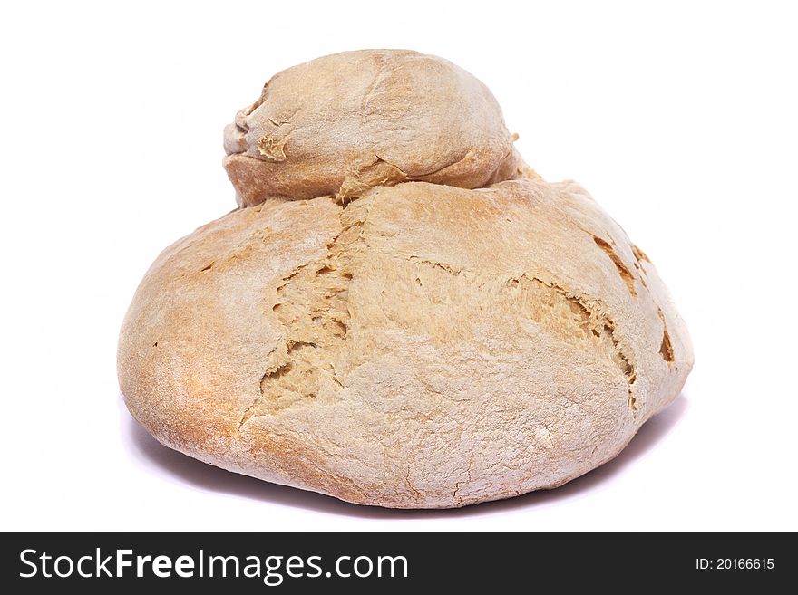 Close up view of a Portuguese traditional baked bread isolated on a white background. Close up view of a Portuguese traditional baked bread isolated on a white background.