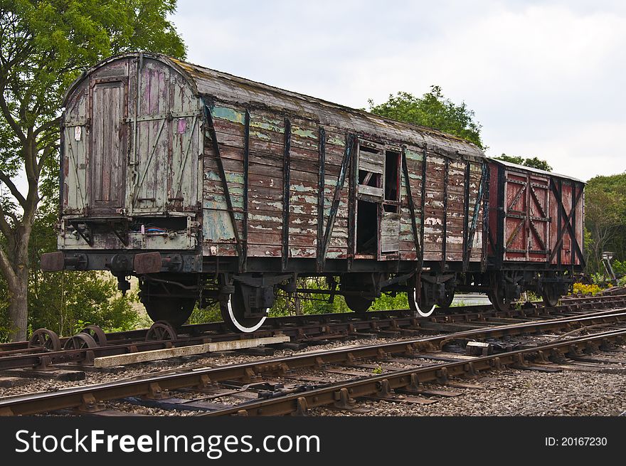 Decaying old wooden railway wagons. Decaying old wooden railway wagons