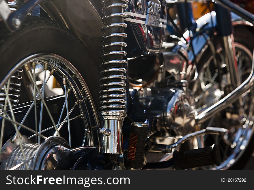 Close up view details of a classic motorcycle in the outdoors.