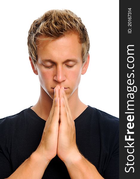 Blonde man clasps his palms together in prayer, isolated on white. Blonde man clasps his palms together in prayer, isolated on white