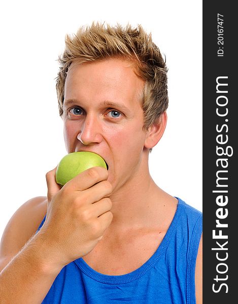 Handsome caucasian man biting into a green apple isolated on white. Handsome caucasian man biting into a green apple isolated on white