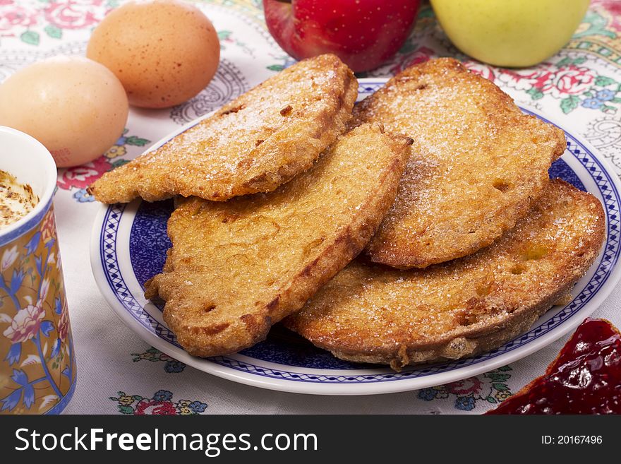 Close up view detail of several golden slices of bread sprinkled with sugar.