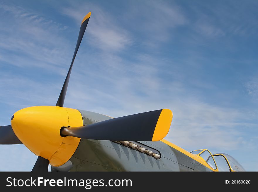 Yellow nose cone and propeller blades of a P-51 Mustang. Yellow nose cone and propeller blades of a P-51 Mustang