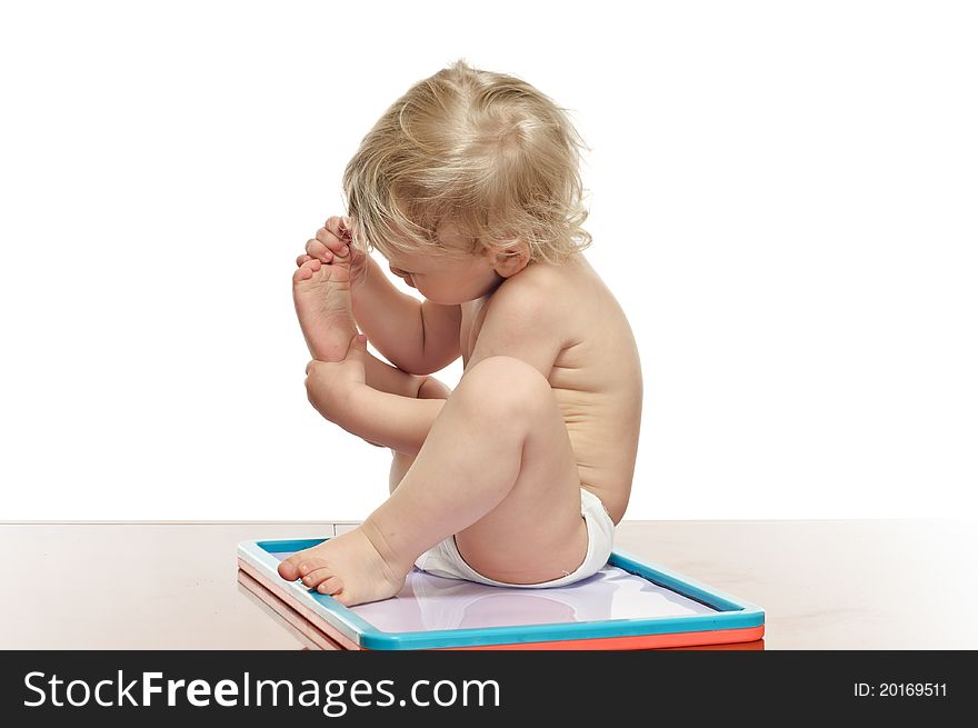 Two years old boy with draw desk on the table. Two years old boy with draw desk on the table