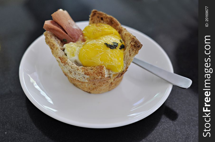 Sausage with egg bun at one newly open cupcakes shop in town. Sausage with egg bun at one newly open cupcakes shop in town