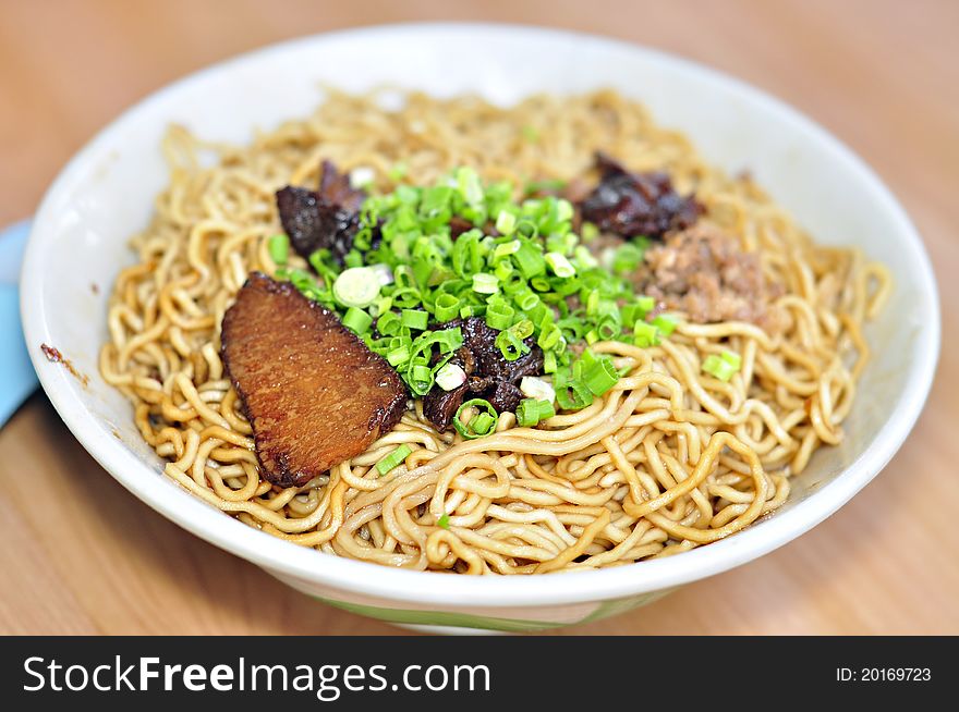 Dried noodle in soy sauce served in one of the popular restaurant in town. Dried noodle in soy sauce served in one of the popular restaurant in town