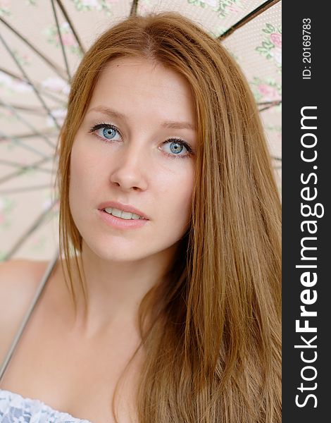 Portrait of a beautiful girl with umbrella at the park. Portrait of a beautiful girl with umbrella at the park