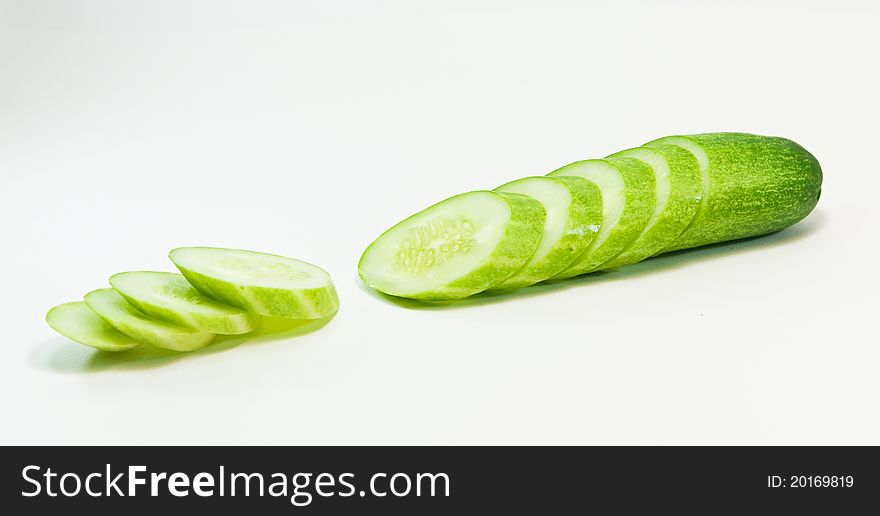 Cucumber and slices isolated on white background. Cucumber and slices isolated on white background.
