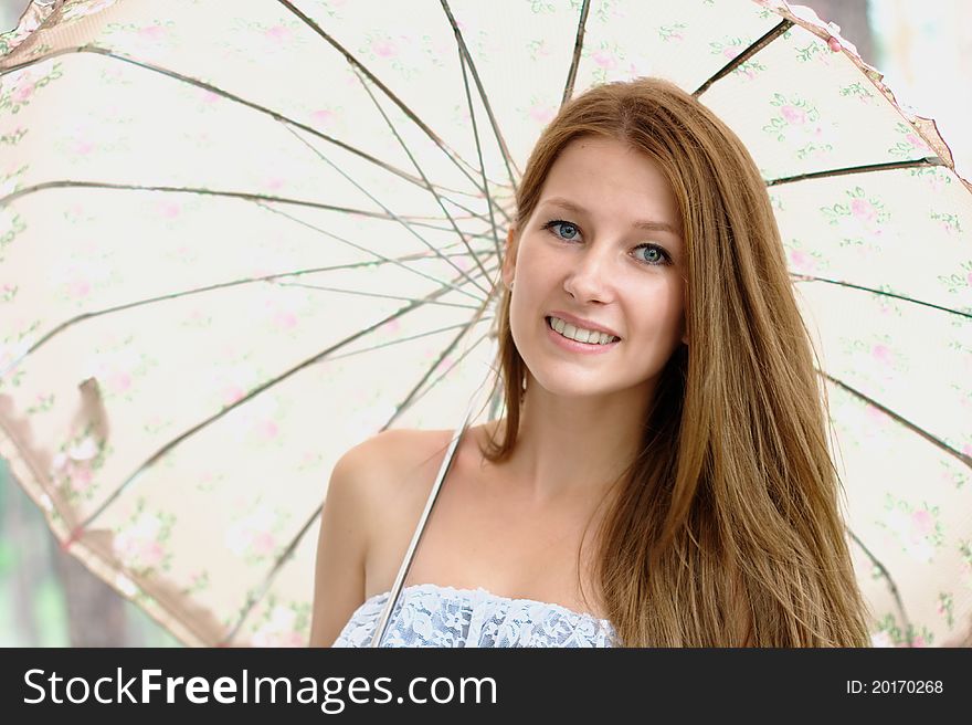 Portrait of a beautiful girl with umbrella