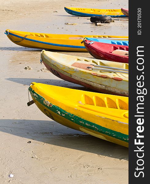 Old Colorful kayaks on the beach