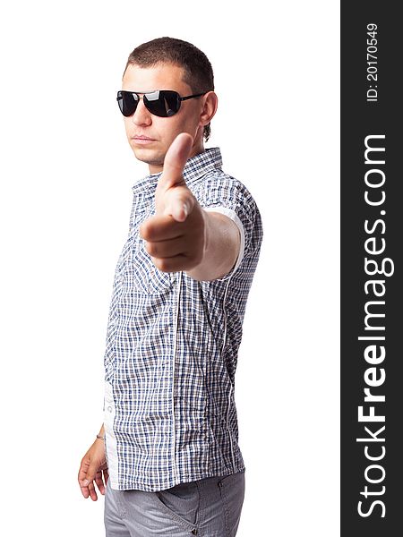 Young man in sunglasses shows forefingers isolated on white background