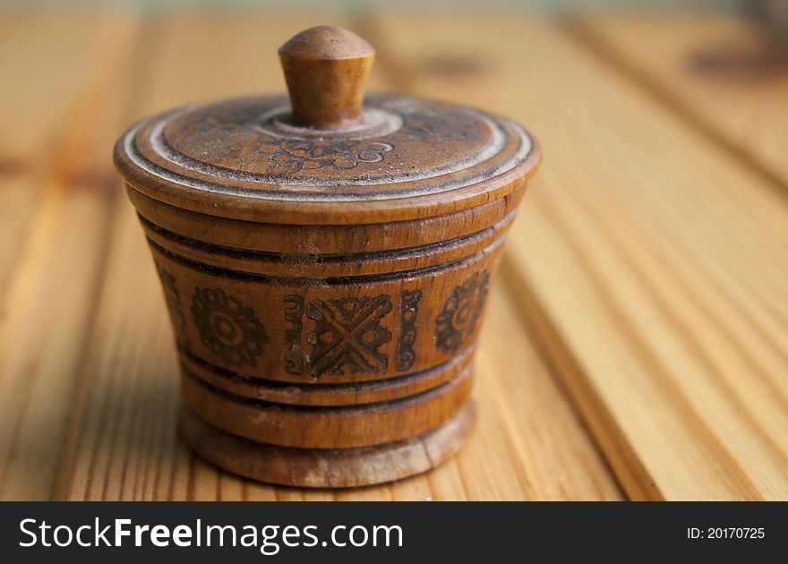 Traditional wood salt-cellar with ornament