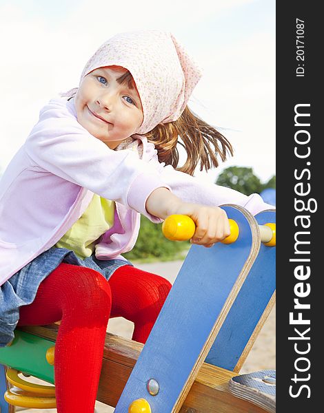 Girl playing on children s playground