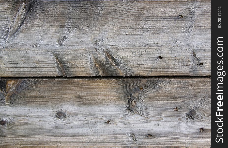 Background of old weathered wooden board. Background of old weathered wooden board
