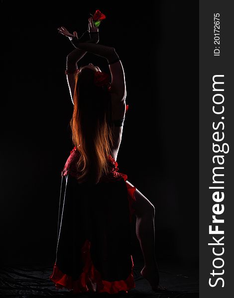 Attractive woman dance in the darkness