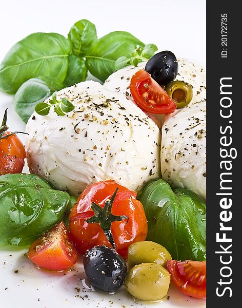 Mozzarella with basil cherry tomatoes and olives