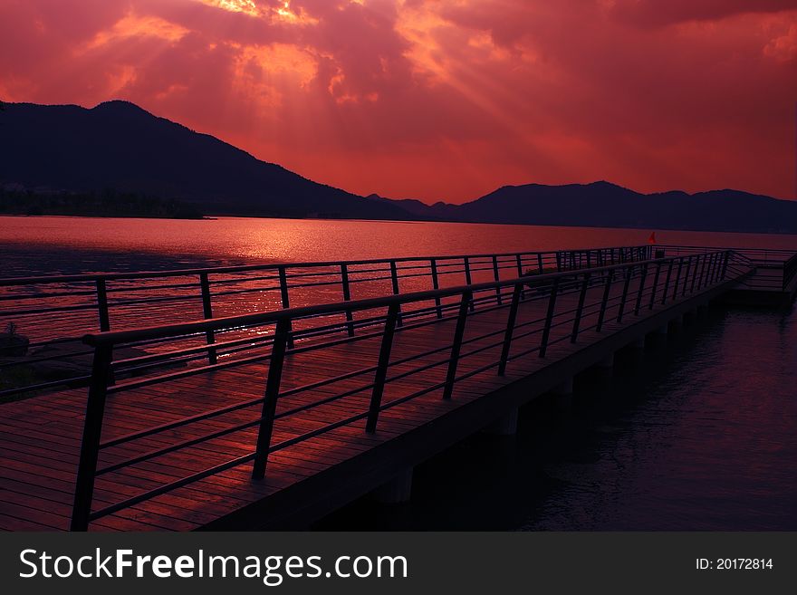 Dock and seascape at dusk