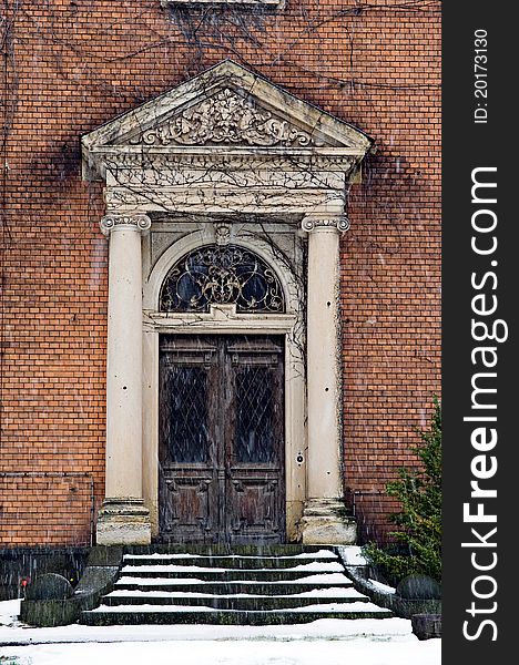 Ancient building with old brick wall in germany. The entrance is well decorated. Ancient building with old brick wall in germany. The entrance is well decorated.