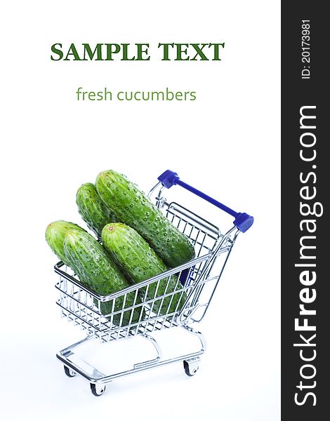Cucumbers in a shopping cart on a white background