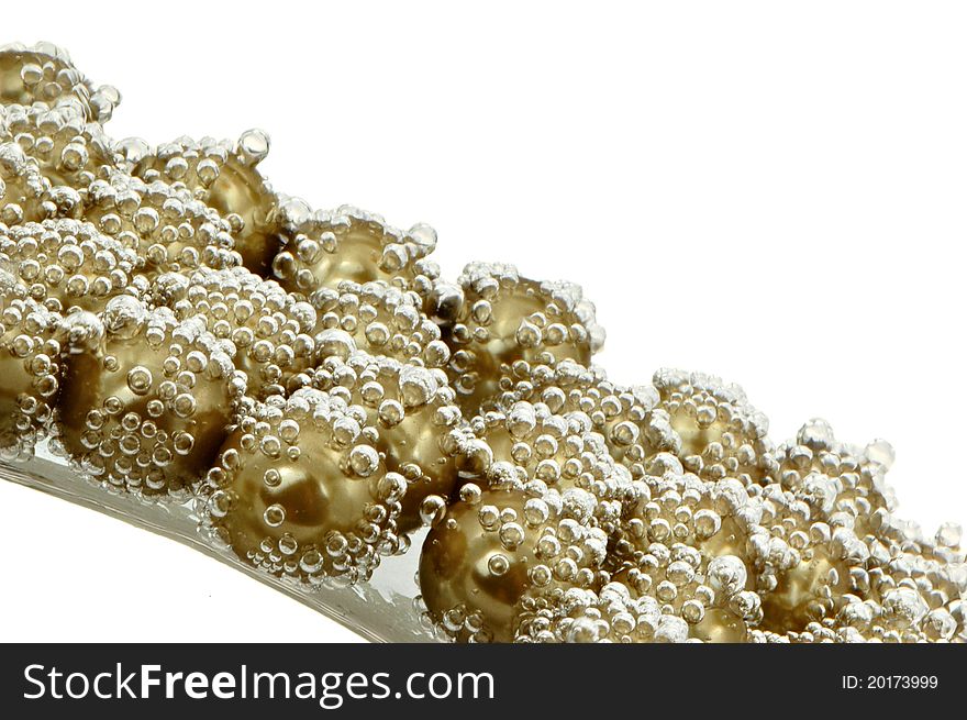 Macro shot of pearls covered with bubbles isolated on white