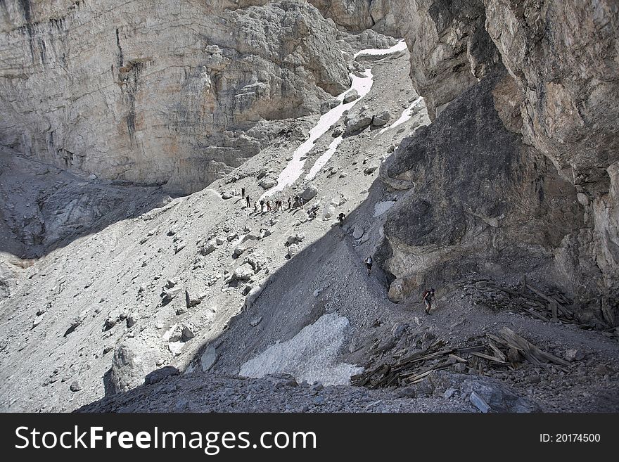 Trekking in Italian Dolomites - people on the mountain trail