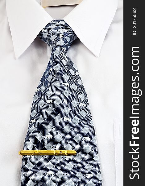 Closeup of white shirt and necktie with tie pin. Closeup of white shirt and necktie with tie pin