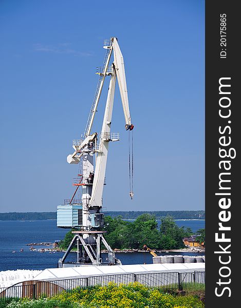 Crane against a background of blue sky. Crane against a background of blue sky