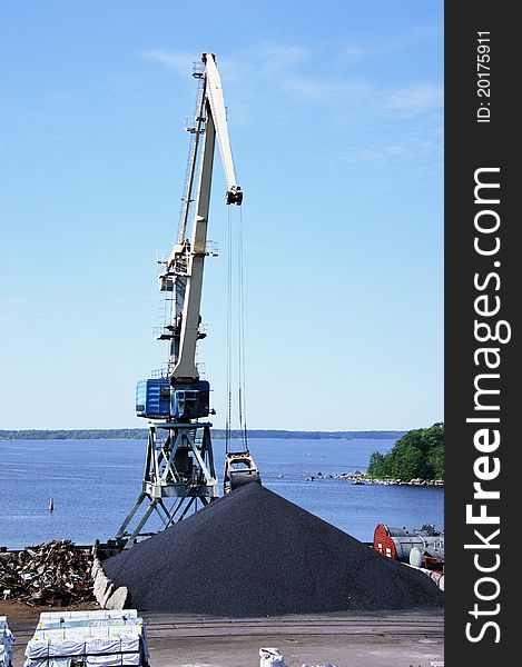 Crane against a background of blue sky. Crane against a background of blue sky