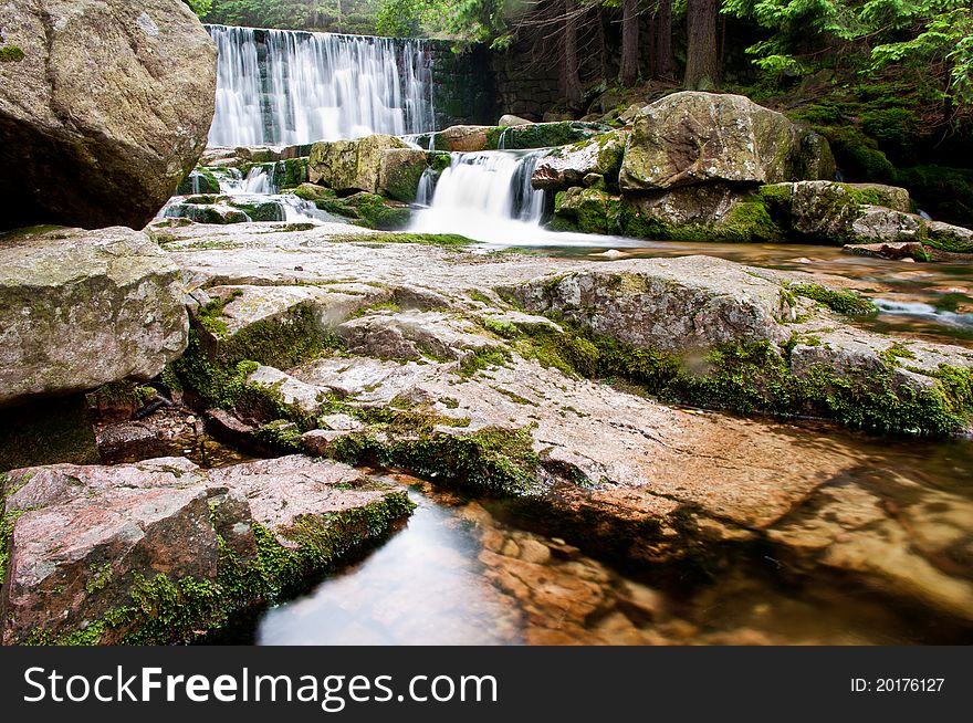 Picture shows a mountain waterfall