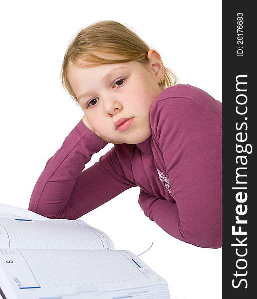 Little girl sleeping while doing her studies isolated