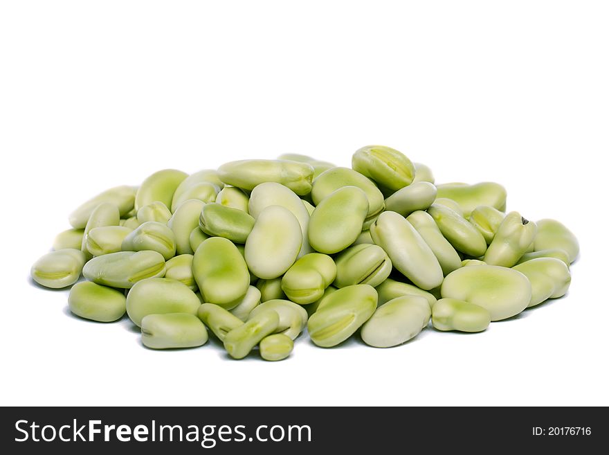 Close up view of some broad beans isolated on a white background.