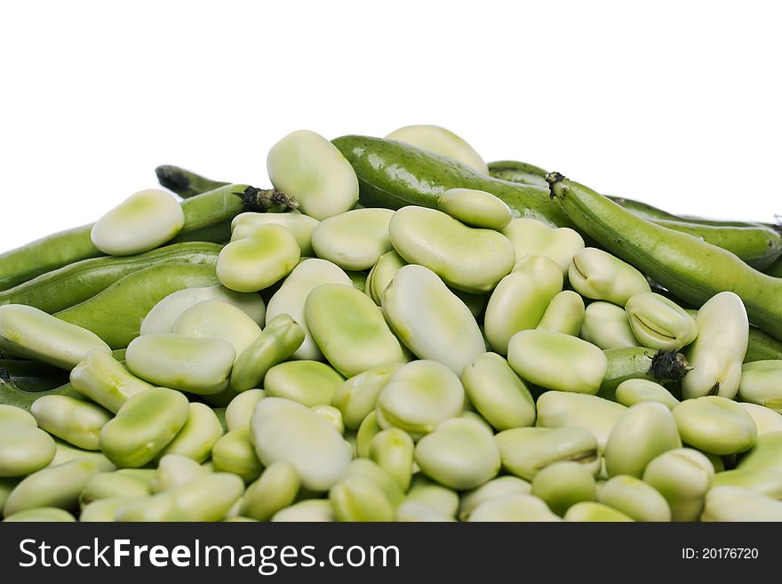 Close up view of some broad beans  on a white background.