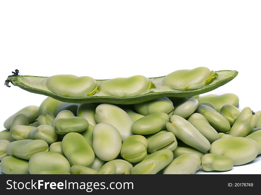 Close up view of some broad beans isolated on a white background.