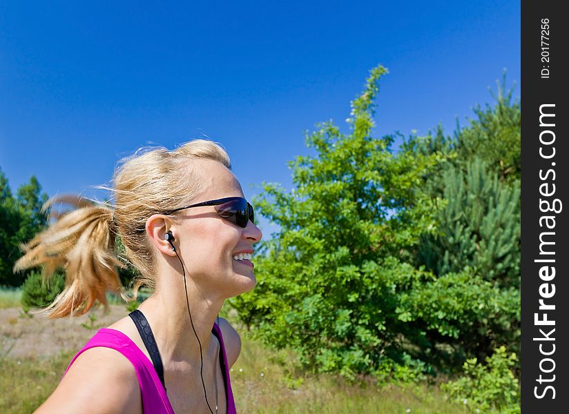 Woman running on country road in summer nature, blurred motion. Woman running on country road in summer nature, blurred motion