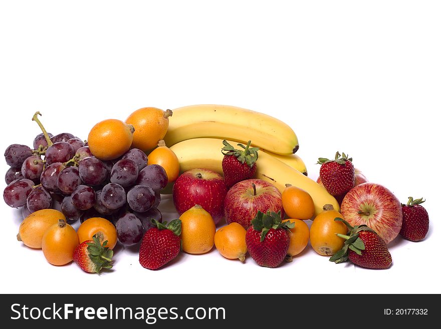 Close up view of a mix of several fruits isolated on a white background. Close up view of a mix of several fruits isolated on a white background.