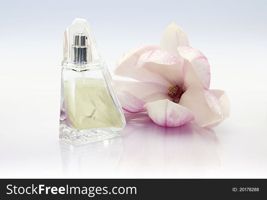 Perfume bottle with flower magnolia