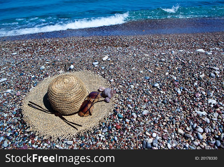 Colorful summer beachwear, hat, sunglasses on sand beach. Colorful summer beachwear, hat, sunglasses on sand beach