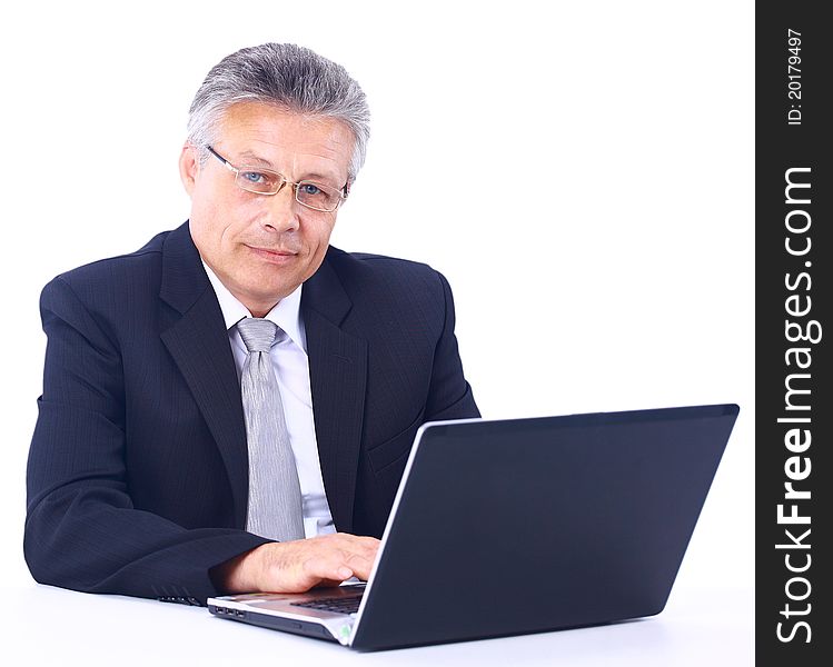 Senior business man working on laptop