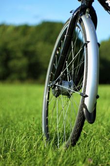 Front Bike Wheel On The Grass Field Royalty Free Stock Photos Front Bike Wheel On The Grass Field Royalty Free Stock Photos