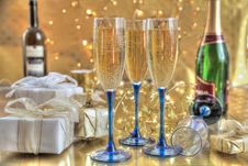 Champagne In Glasses, Gift Boxes And Lights Stock Images Champagne In Glasses, Gift Boxes And Lights Stock Images