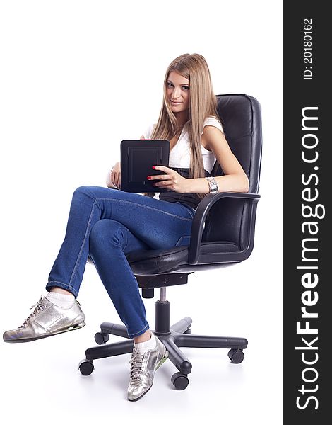 Beautiful Young Woman Using Tablet Computer On Office Chair. Beautiful Young Woman Using Tablet Computer On Office Chair