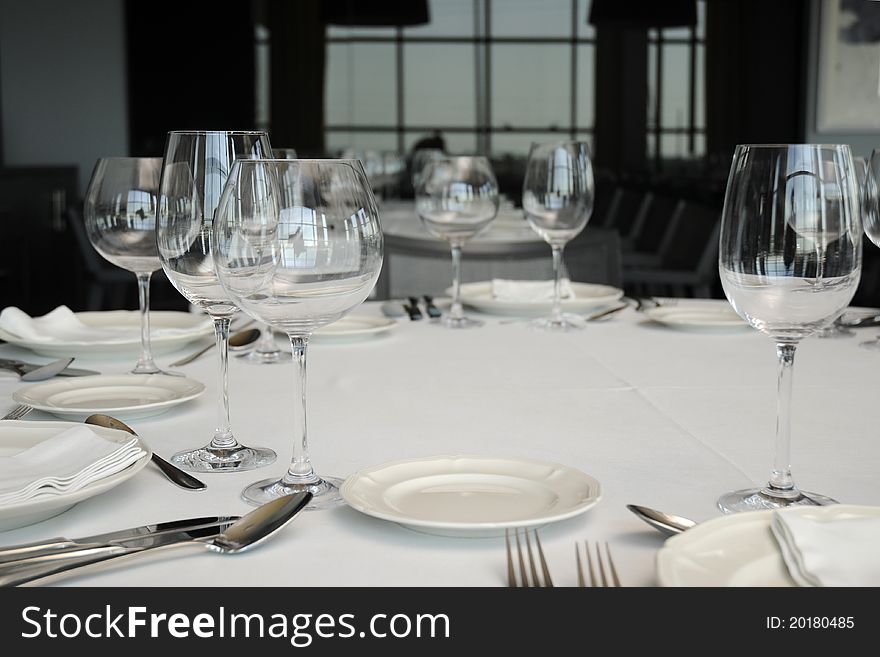 Wineglass And Plates On Table.